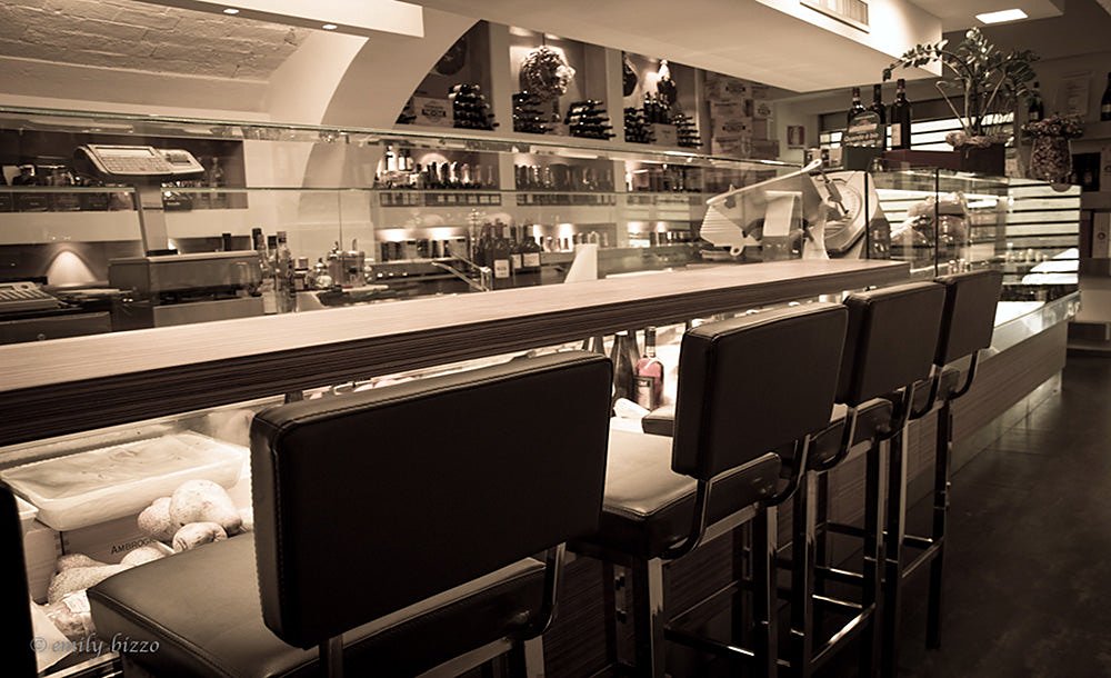 Counter seating and display cases at Zeb