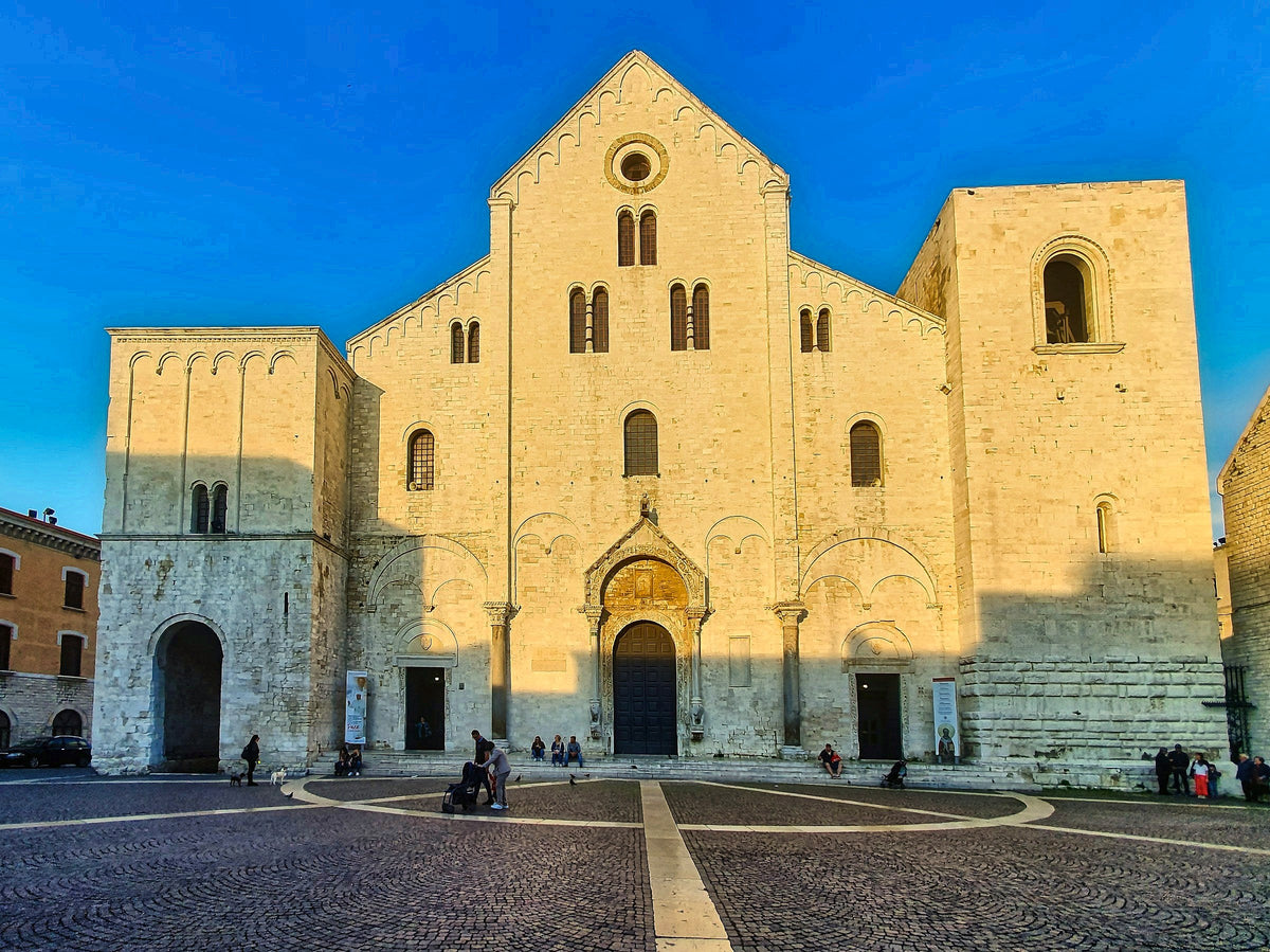 Warm evening light on the Romanesque facade of the Basilica of San Nicola