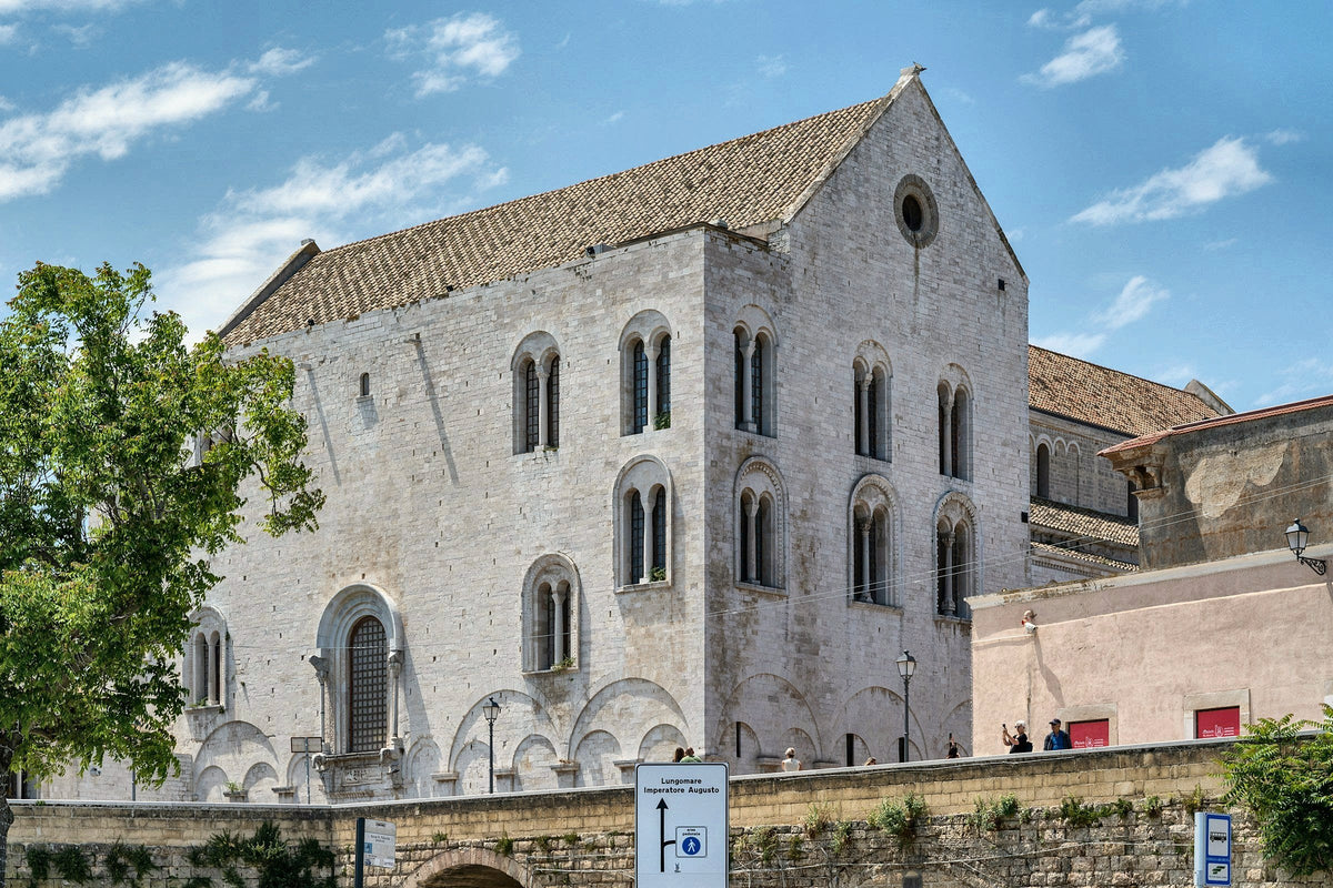 The side of the Basilica of San Nicola with its arched windows and blind arcades