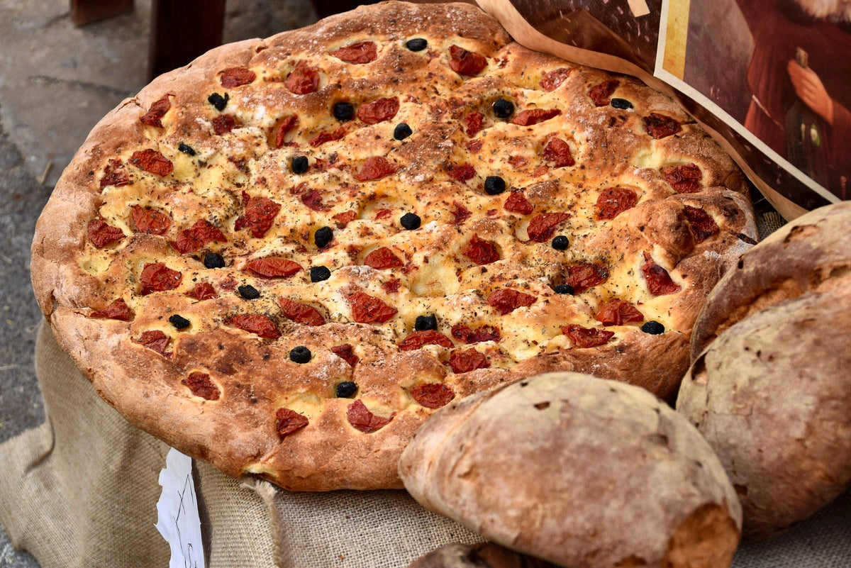 Focaccia barese topped with cherry tomatoes and olives