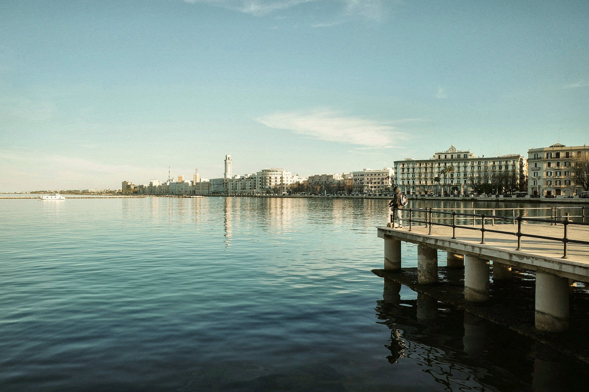 The long seafront promenade seen from a pier in soft light