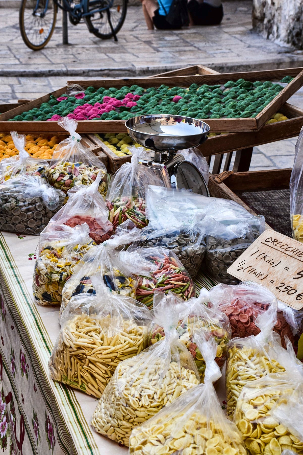 Bags of handmade pasta for sale at a street stall