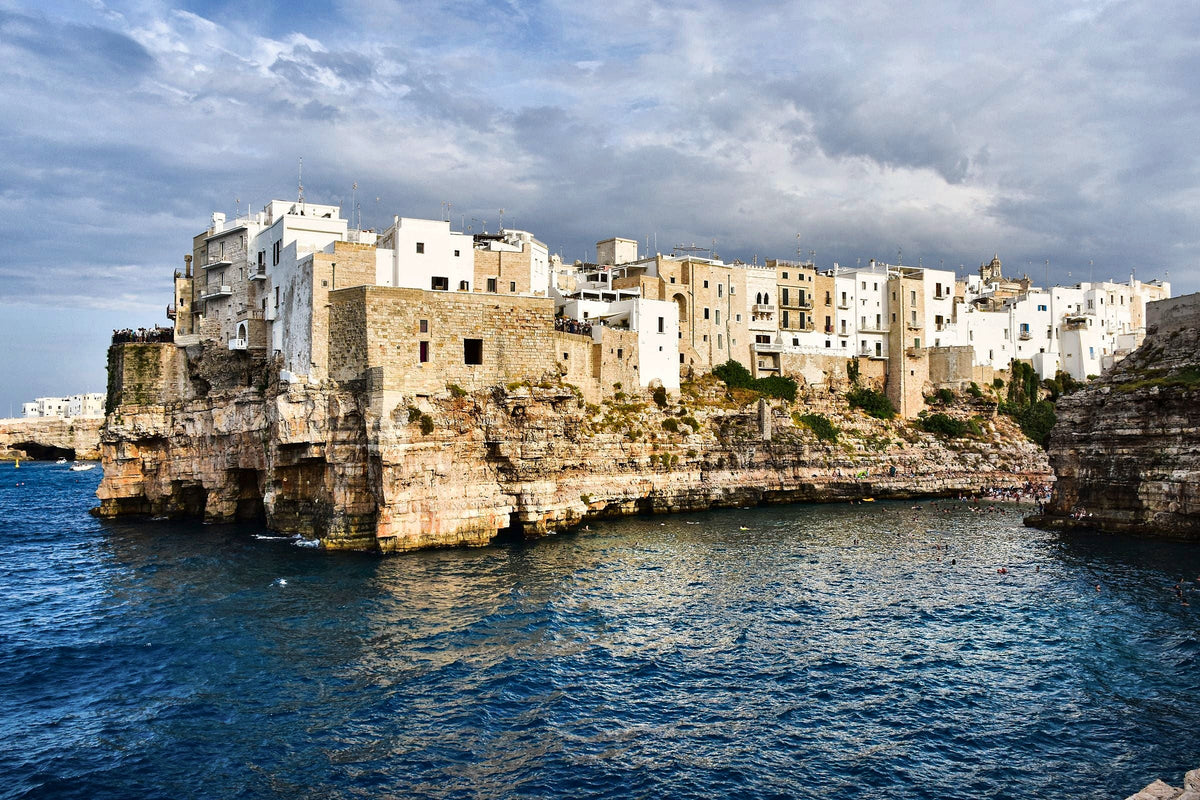 Whitewashed houses on the cliffs of Polignano a Mare