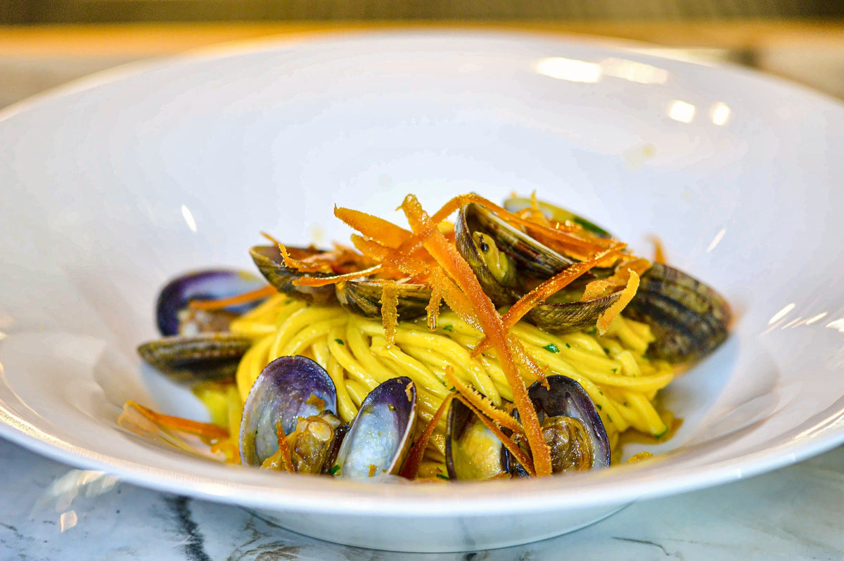 Square spaghetti with clams and mullet bottarga at Eddycola