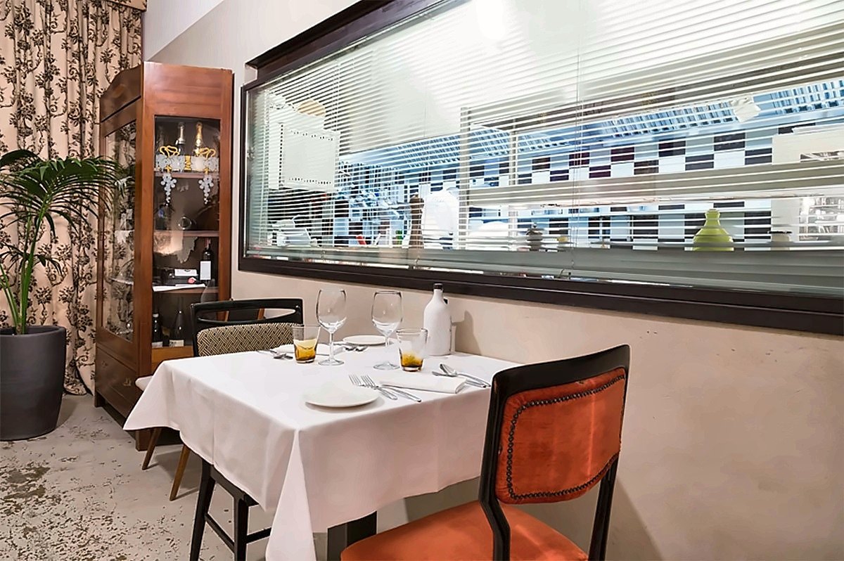 A table by the kitchen window in the dining room of La Bul