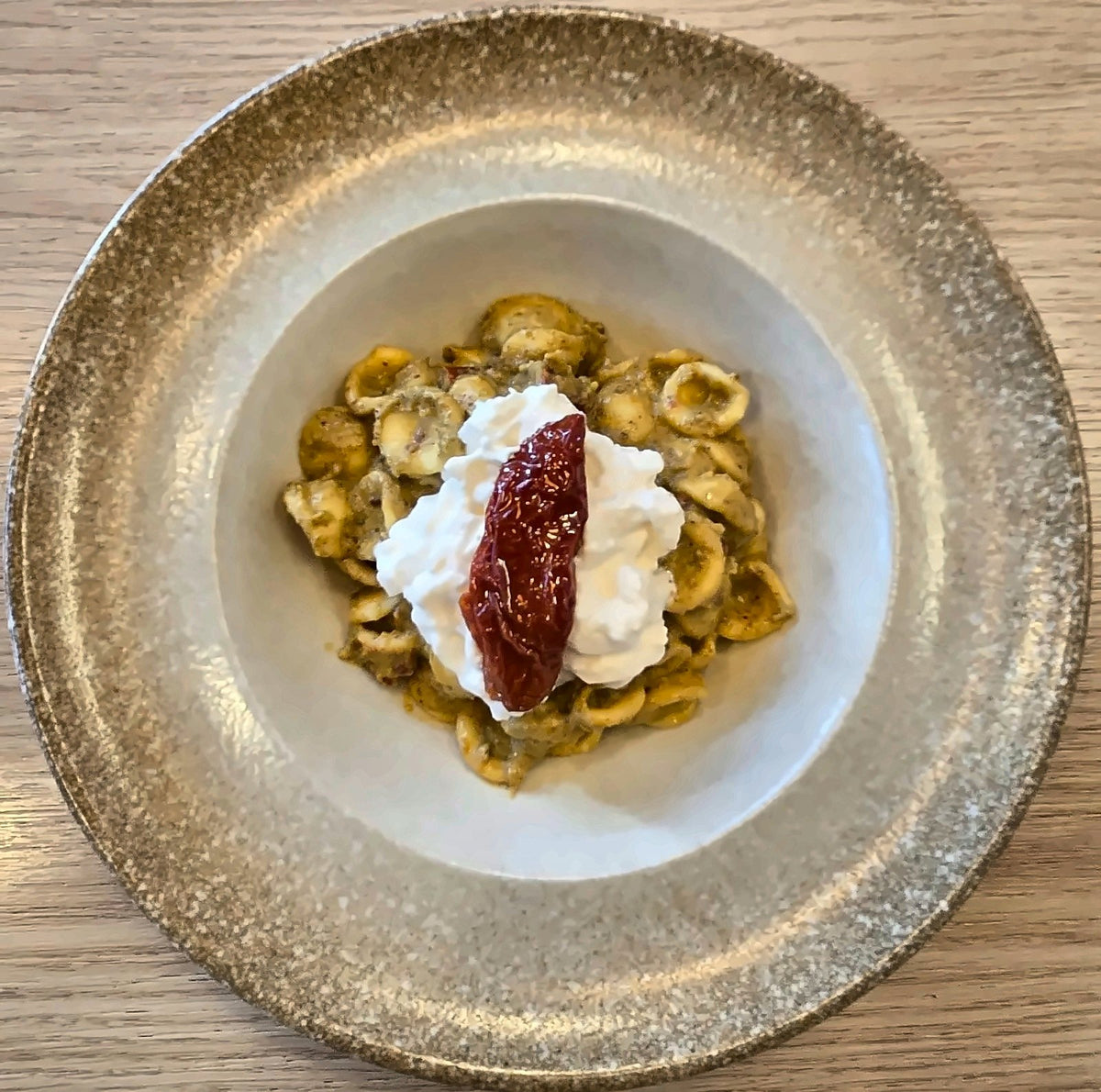 Orecchiette topped with stracciatella and a sun-dried tomato at Matiti Pasta Bistrot