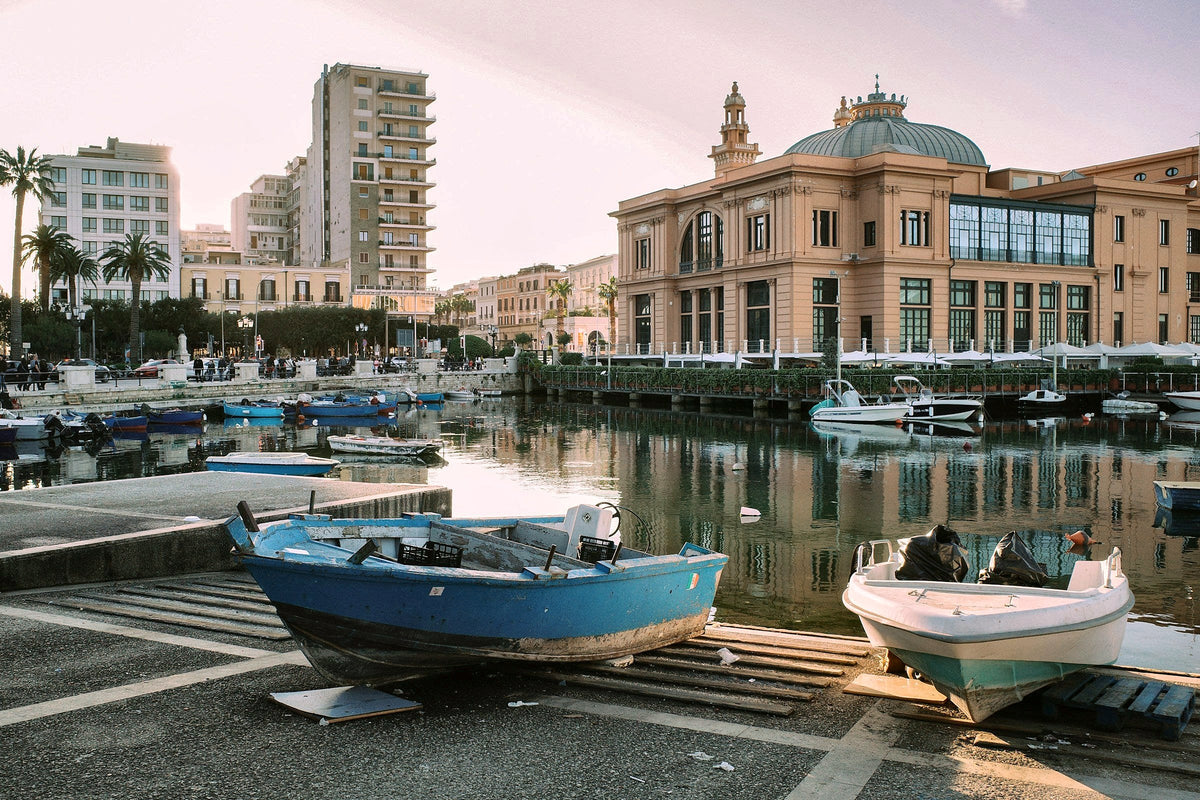 Teatro Margherita and fishing boats on the old port at sunset