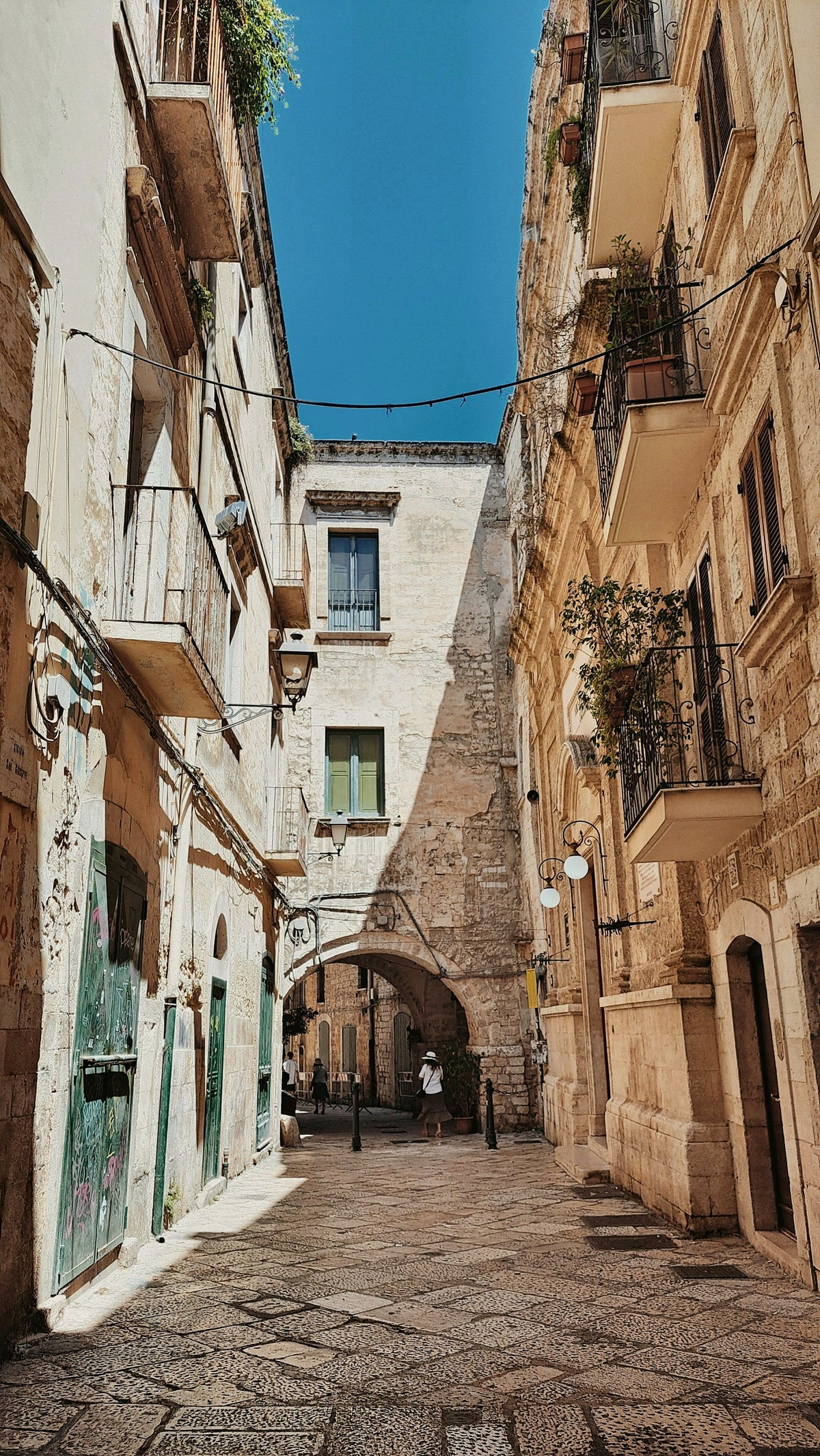 A quiet lane of pale stone houses in the old town