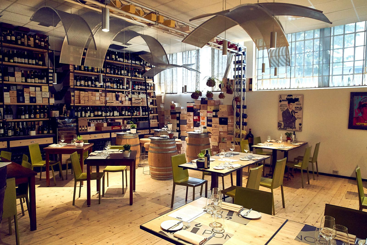Wine-lined dining room at Al Carroponte