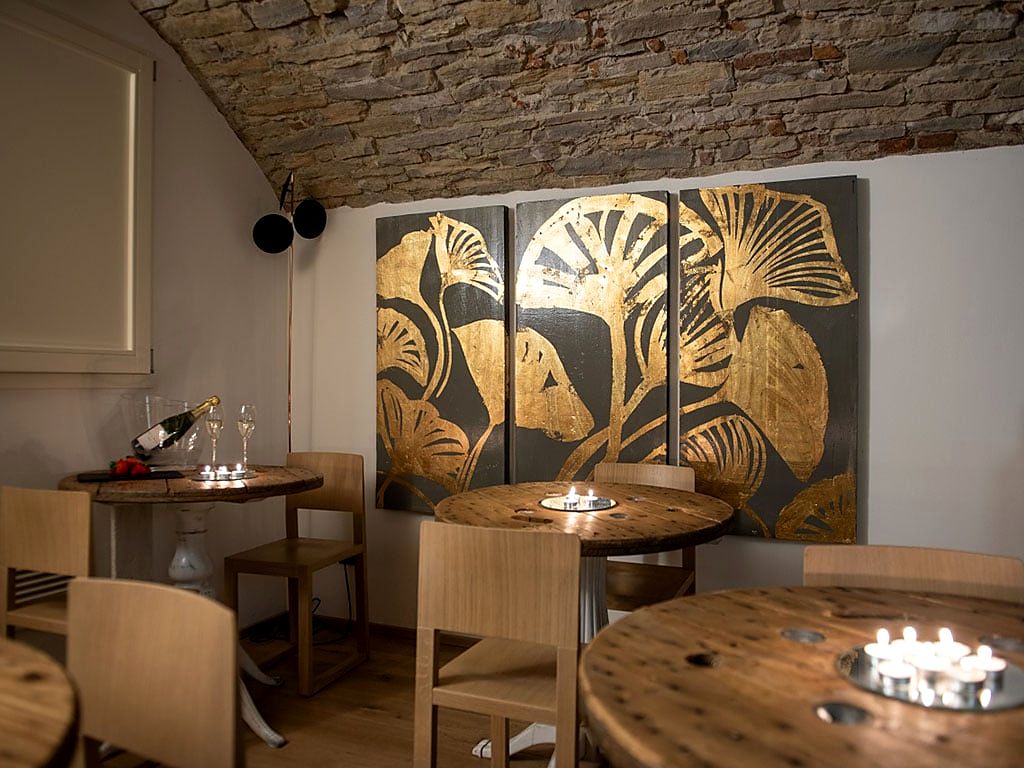 Bar lounge under a stone vault at Le Funi Hotel