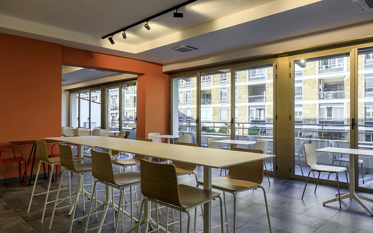 Breakfast room with floor-to-ceiling windows at B&B Hotel Catania City Center