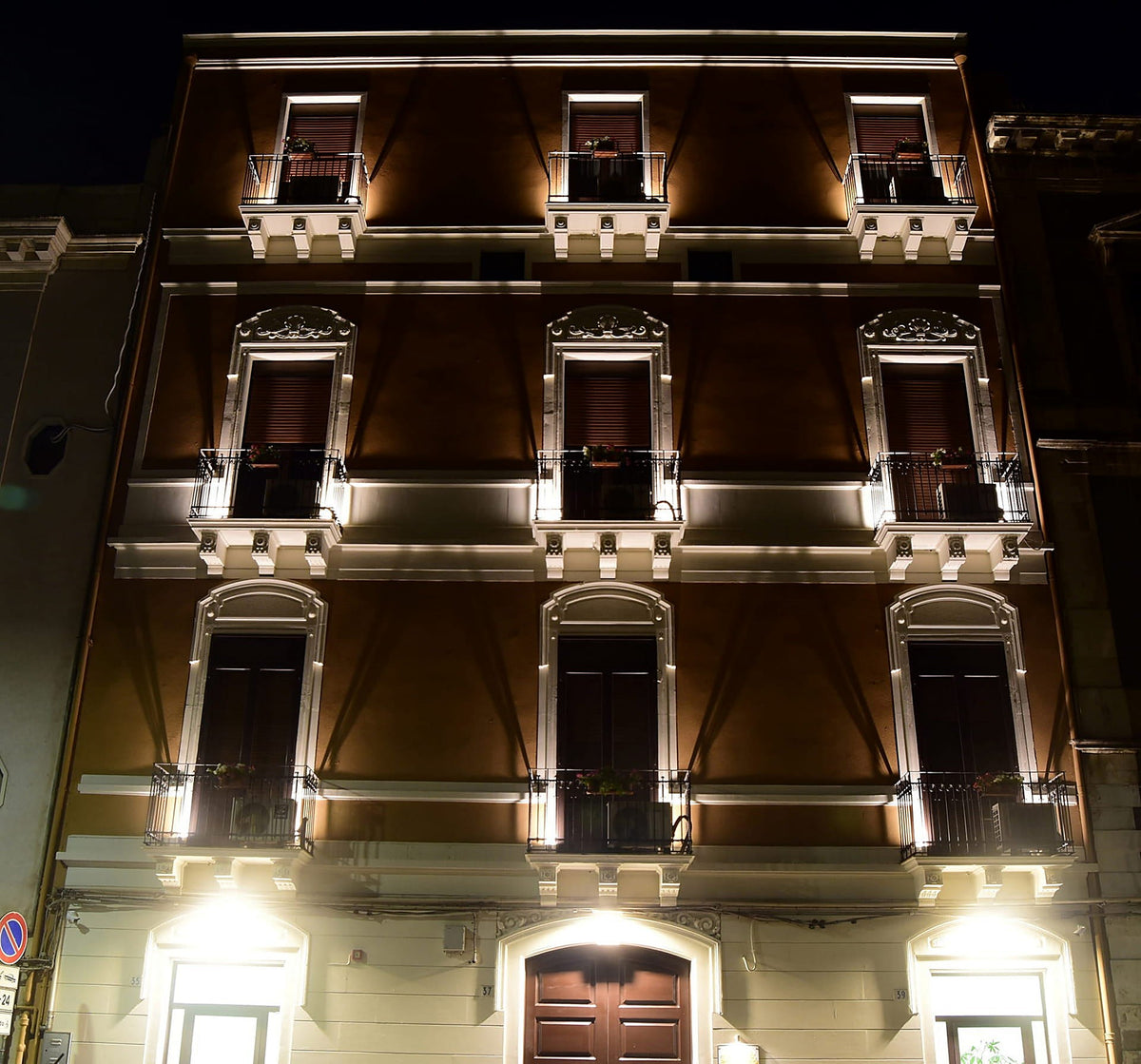 Hotel Centrum's historic building illuminated at night