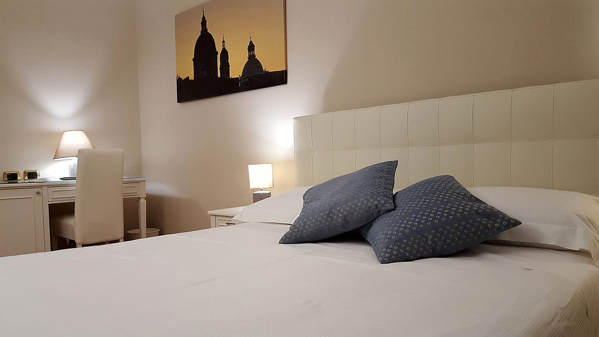 Double room with upholstered headboard at Hotel Centrum