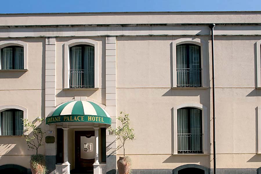 Entrance of Katane Palace Hotel with its green awning