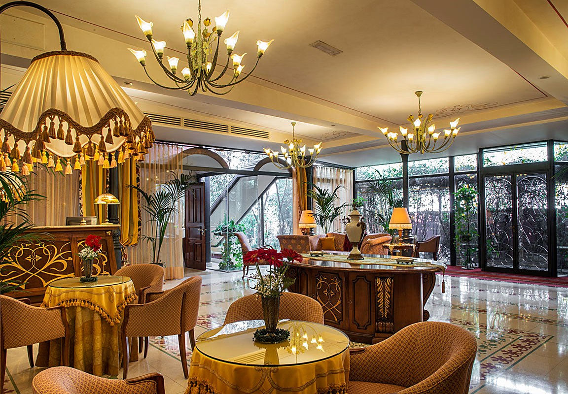 Lobby lounge with chandeliers and period furnishings at Liberty Hotel