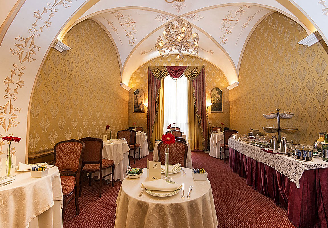 Breakfast room under a vaulted, decorated ceiling at Liberty Hotel