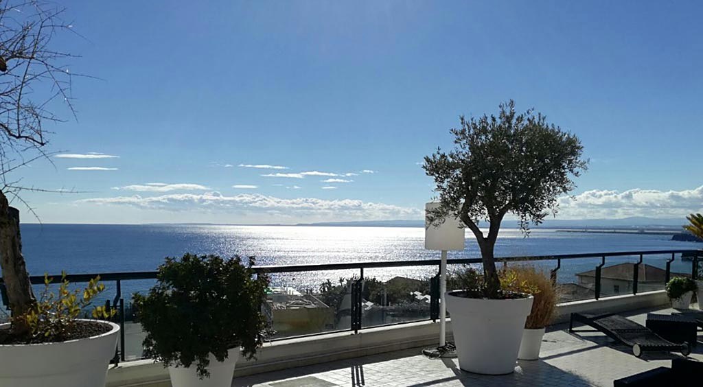Rooftop terrace overlooking the Ionian Sea at Plaza Hotel Catania