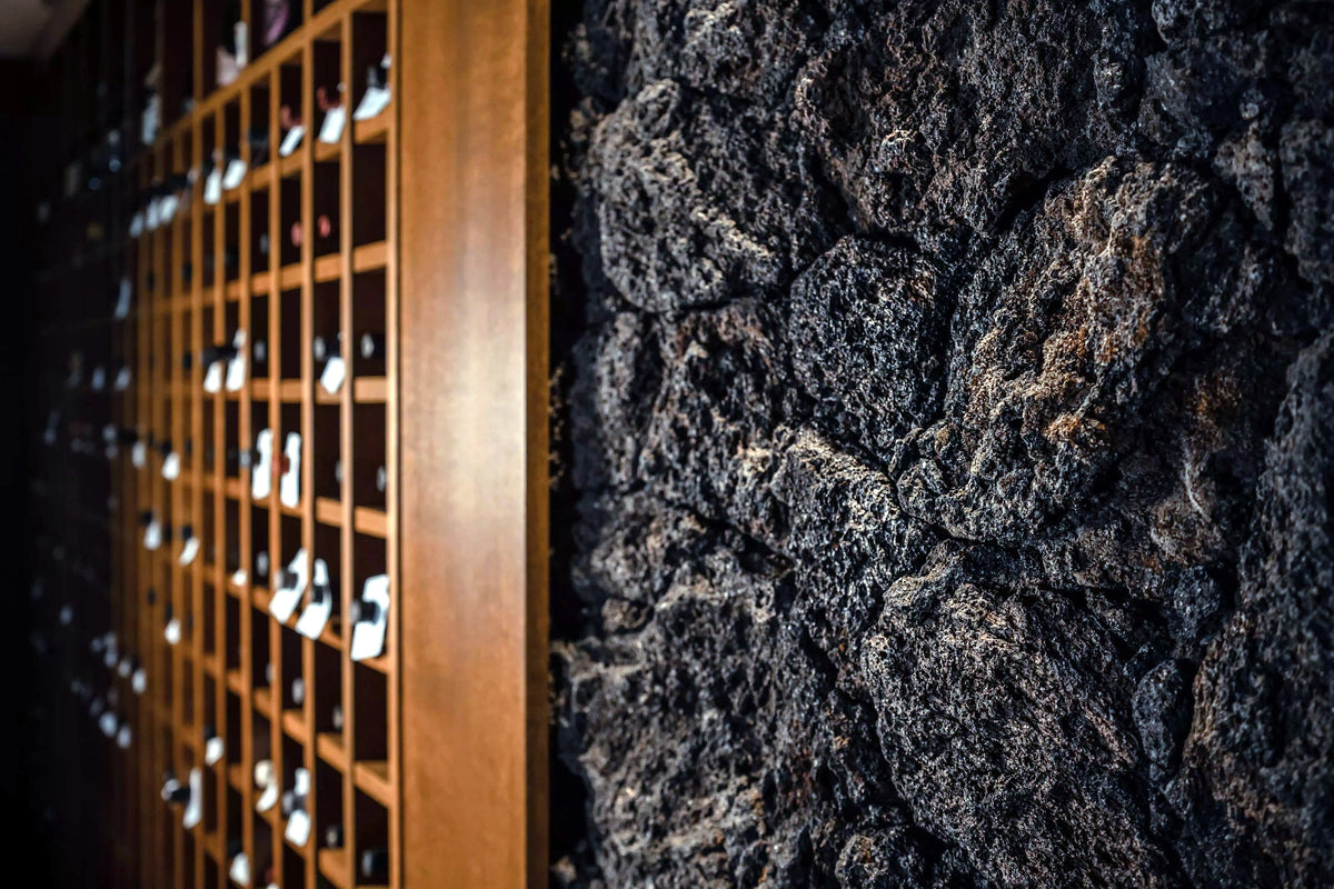 Wine wall and lava-stone interior at Sapio