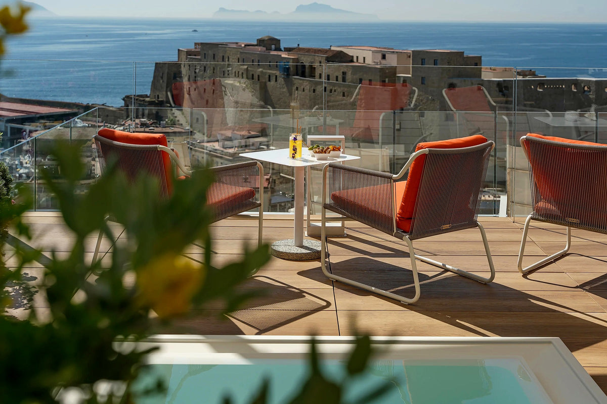 Rooftop terrace view of Castel dell'Ovo at Grand Hotel Vesuvio