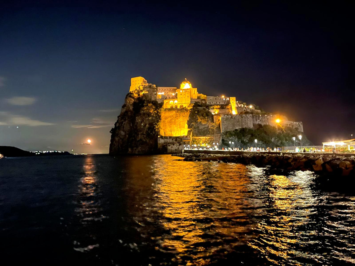 The Aragonese Castle of Ischia lit up at night