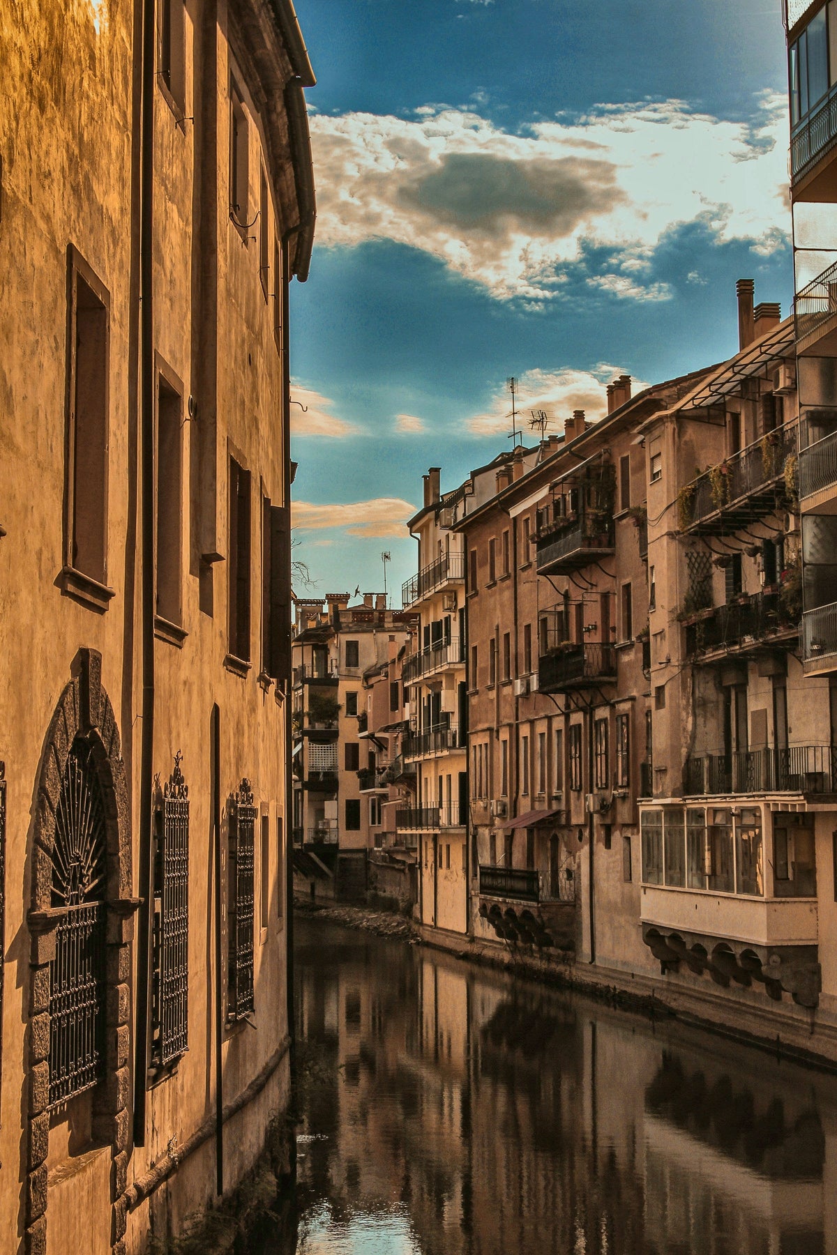 Warm evening light on a canal between old palazzi