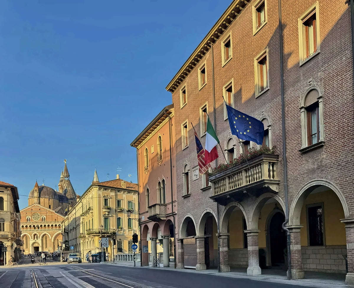 Arcaded street outside Hotel Serafino with the Basilica of Saint Anthony in the distance