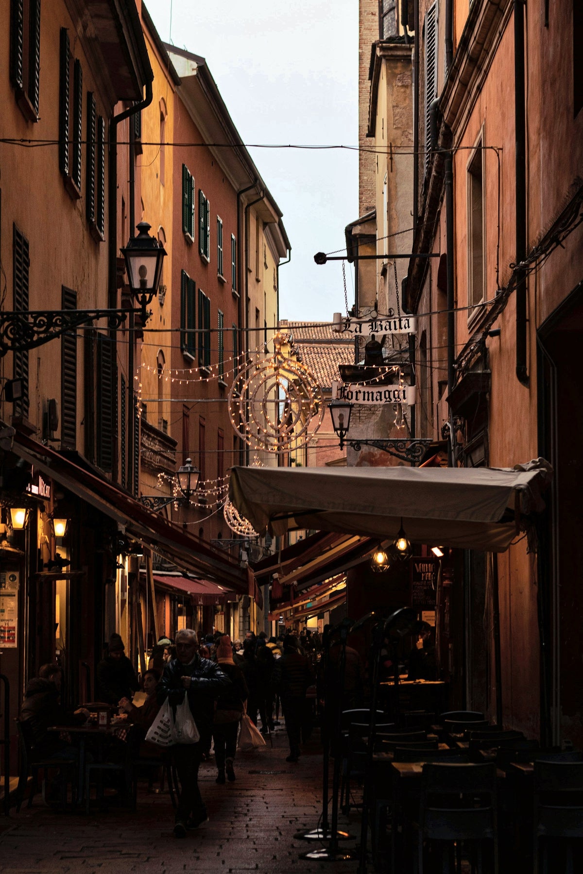 Lights coming on in a narrow street of the old town