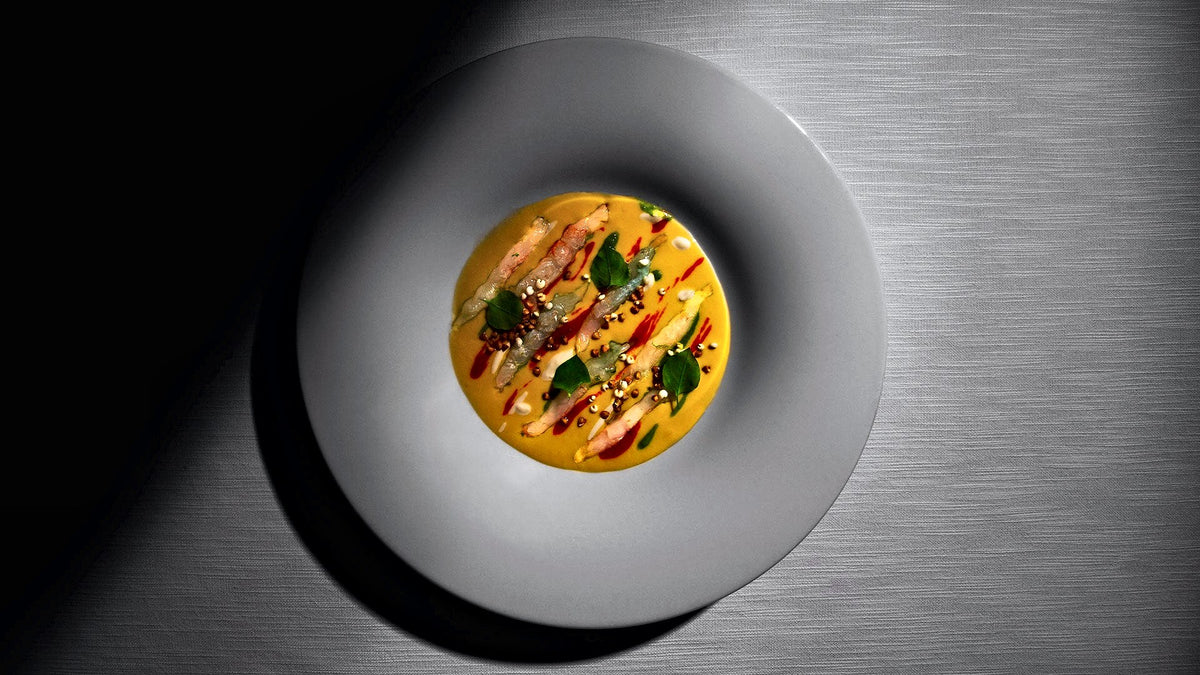 Plated seafood starter in a wide white bowl at Ai Navigli, Padua