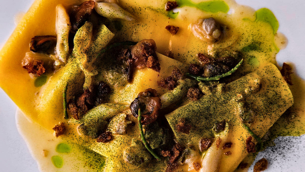 Fresh pasta with sauce and herbs served at Ai Navigli, Padua