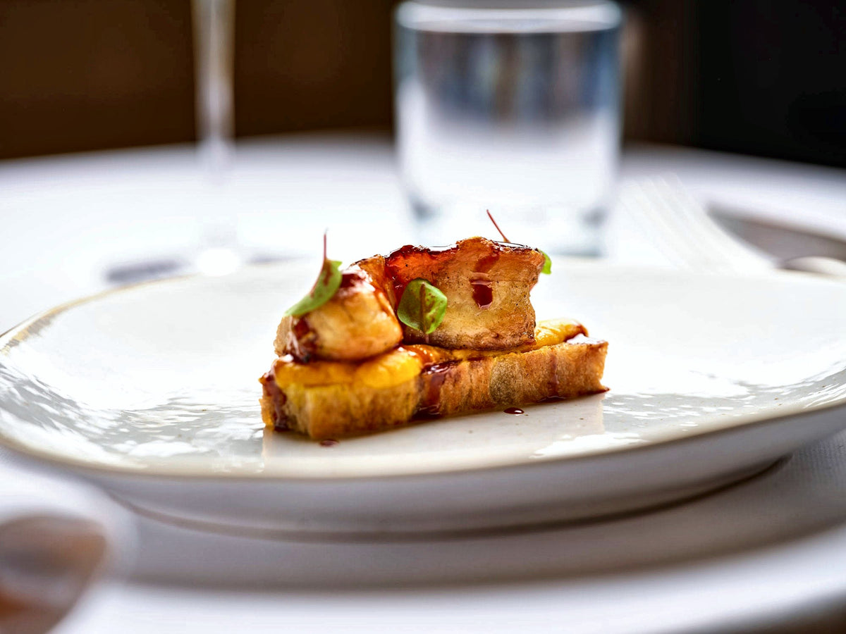 Plated dish on a white tablecloth at Ai Porteghi Bistrot, Padua