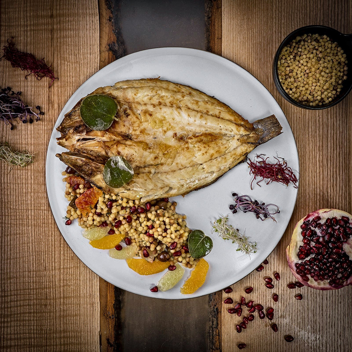 Grilled whole fish with grains, citrus and pomegranate at Il Desco, Padua