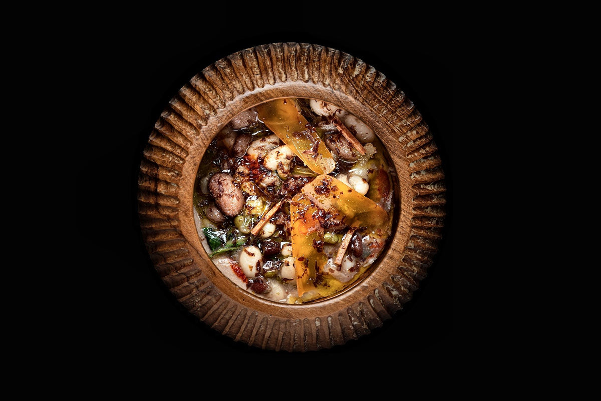 Bean soup with tuna and bottarga in a ribbed bowl at Le Calandre, Rubano