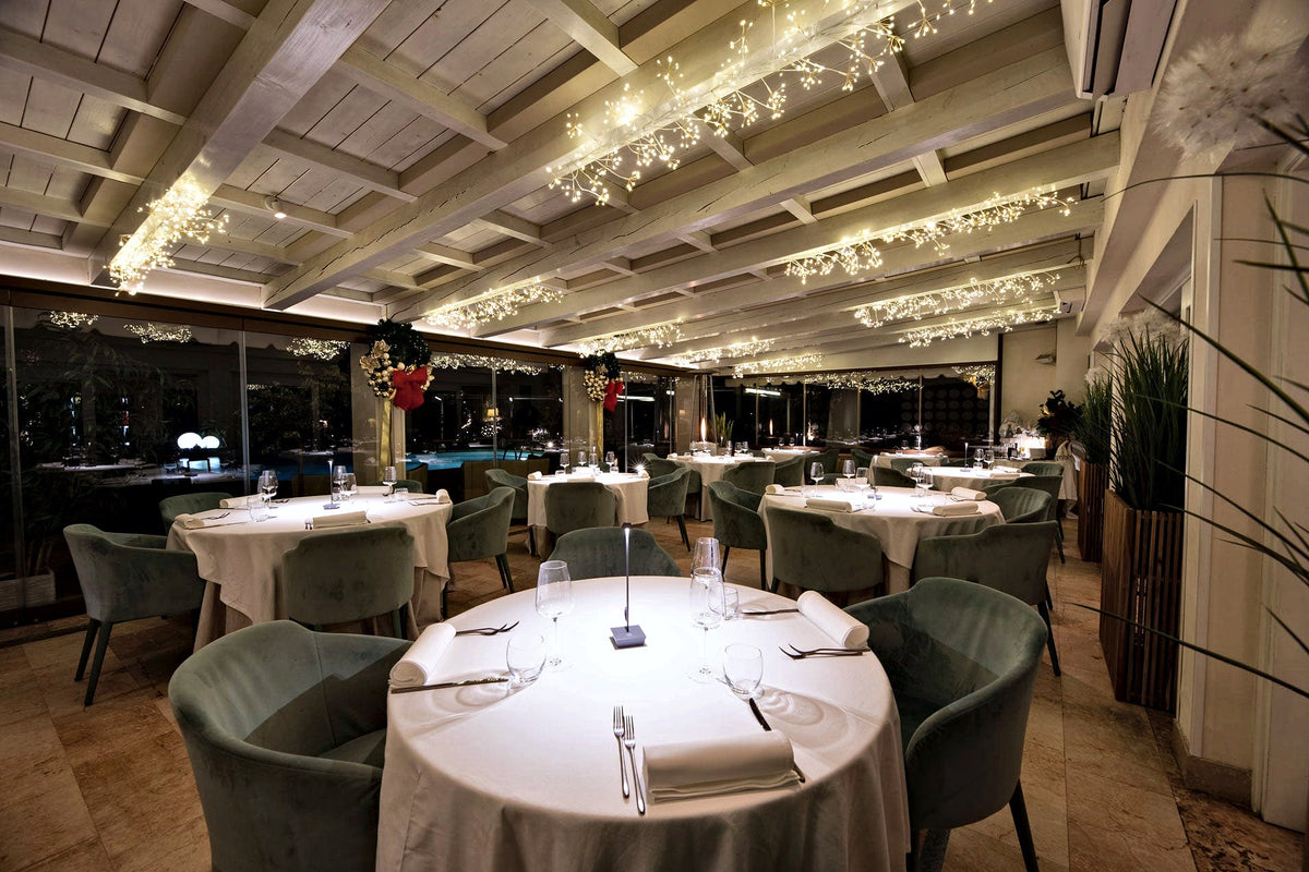 Veranda dining room with string lights at Villa Tevere, Padua