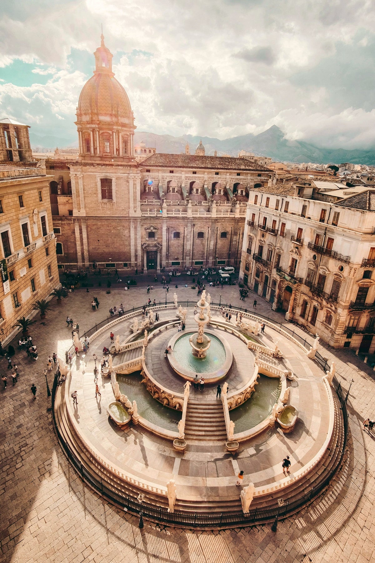 The Fontana Pretoria seen from above, with the dome of Santa Caterina