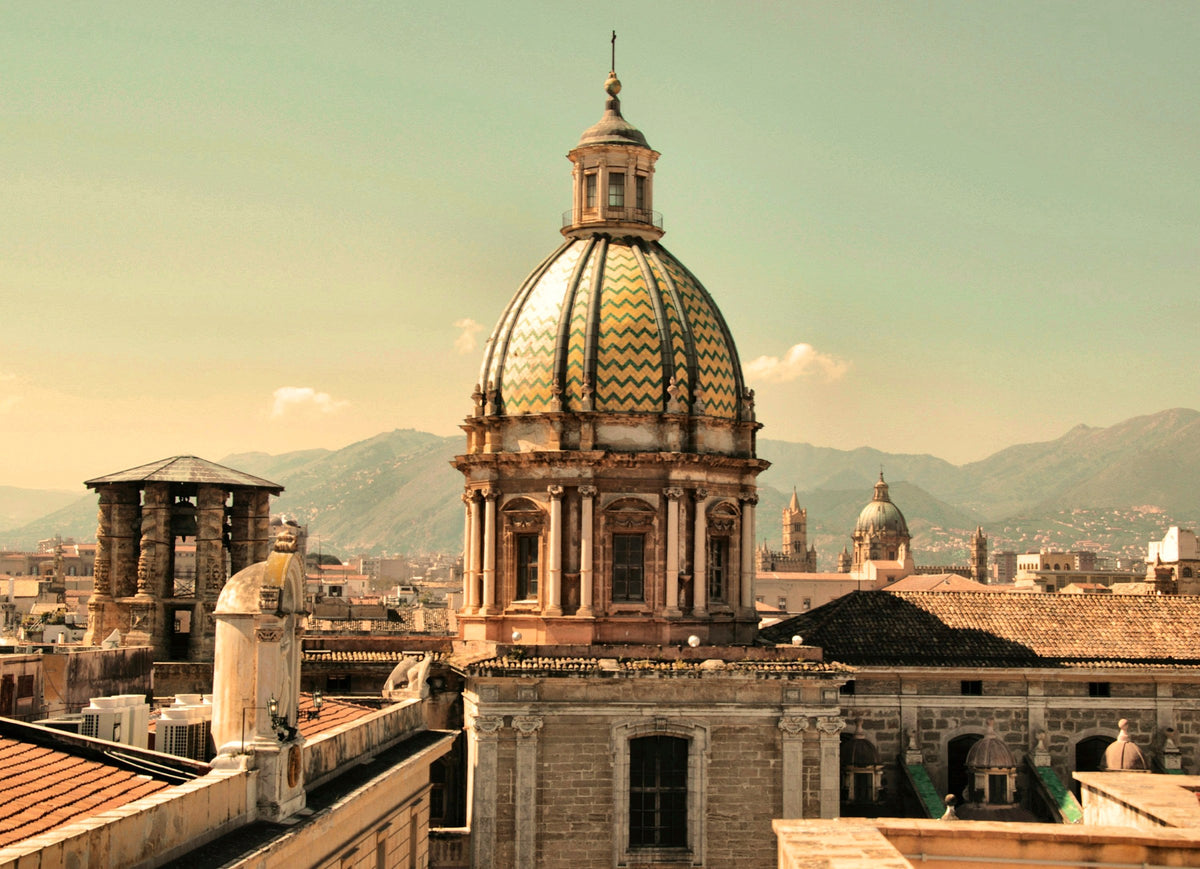 A majolica-tiled dome above the rooftops of the old town