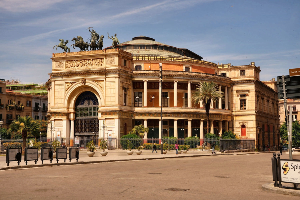 Teatro Politeama Garibaldi and its bronze chariot in late-afternoon light