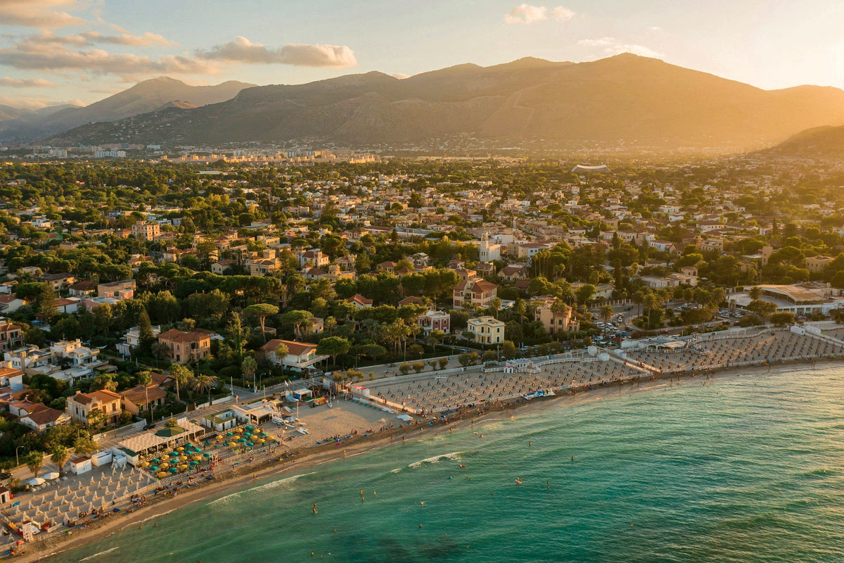 Mondello beach and its villas at golden hour, seen from above