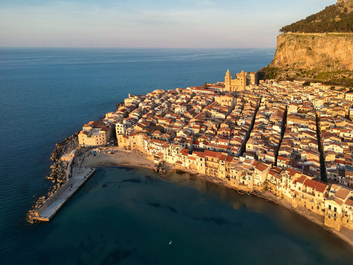 Cefalù at golden hour, between its rock and the Tyrrhenian Sea