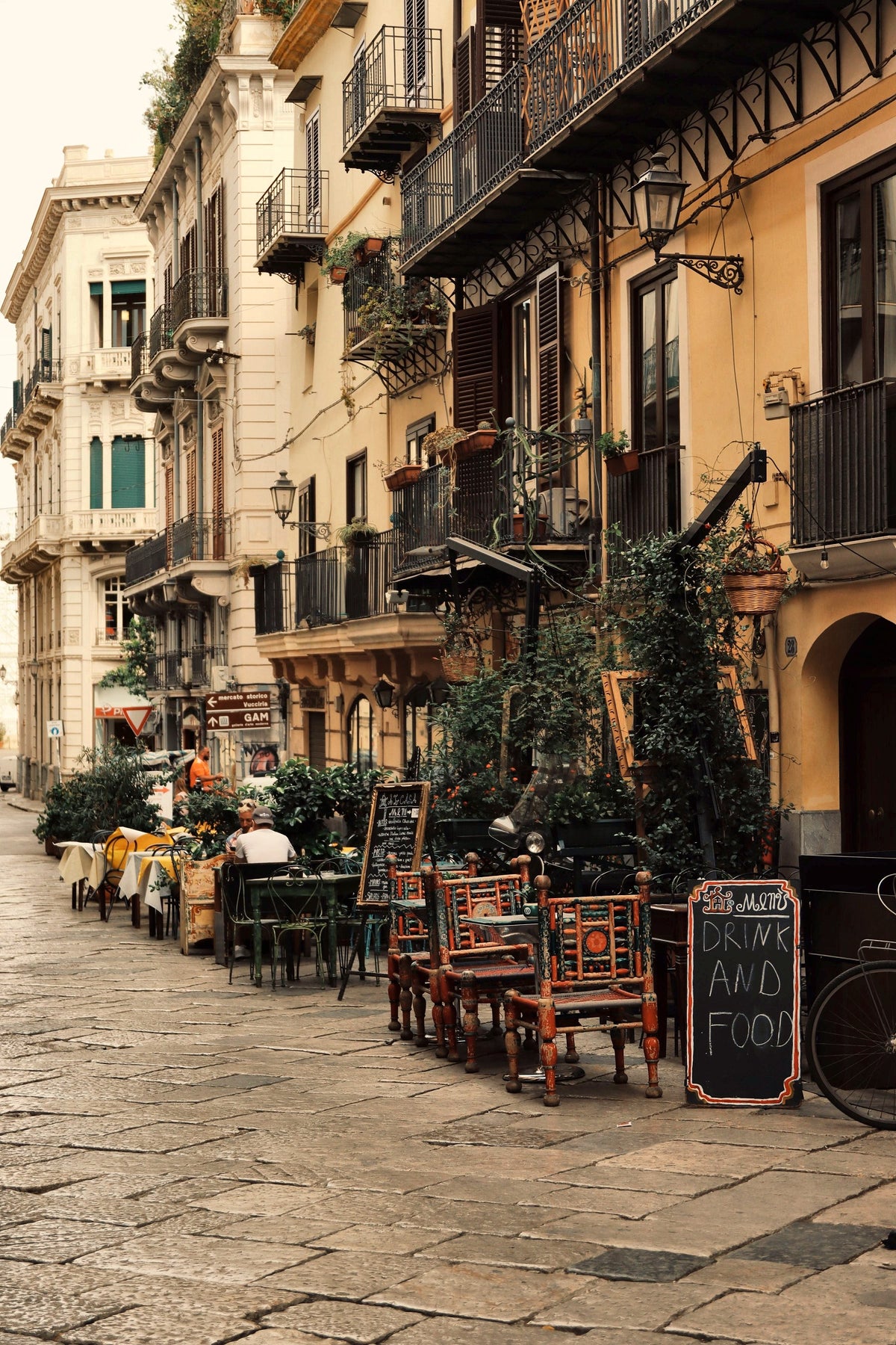 Café tables along a quiet street in the old centre