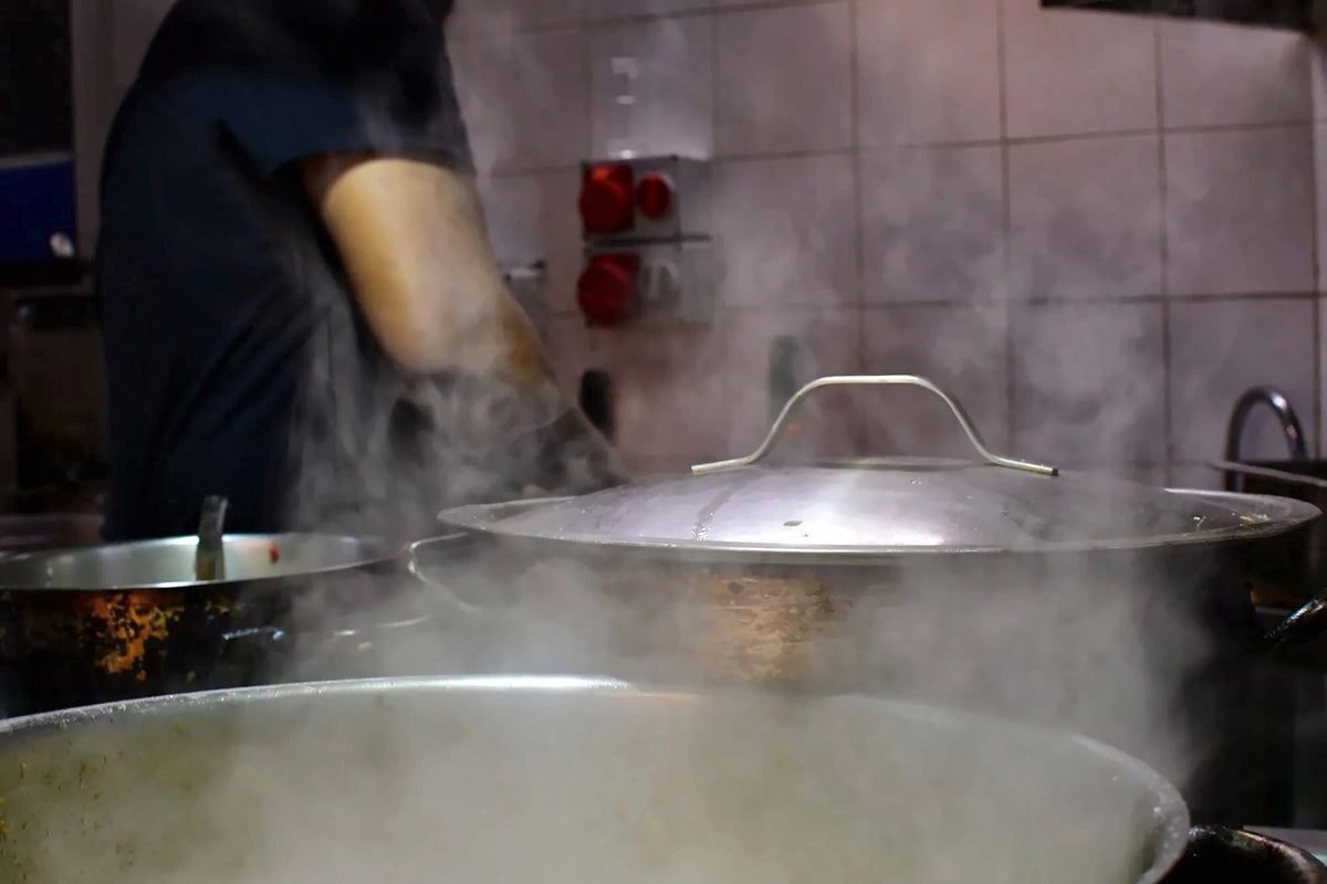 Pots steaming in the kitchen of Bisso Bistrot