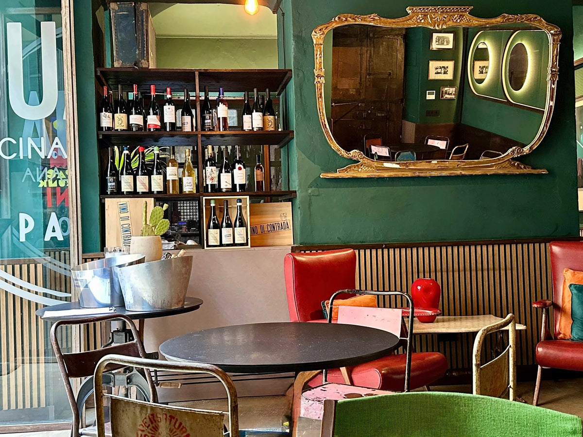Vintage furniture and the bar inside Buatta Cucina Popolana