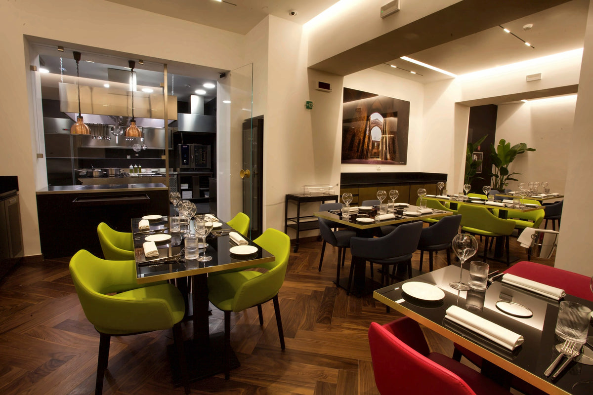 The dining room of CR21 with its green chairs