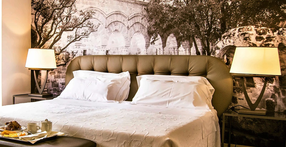 A room with a Palermo mural at Hotel Federico II Central Palace