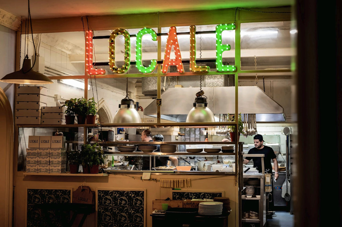 The kitchen pass below the lettering of Locale Palermo