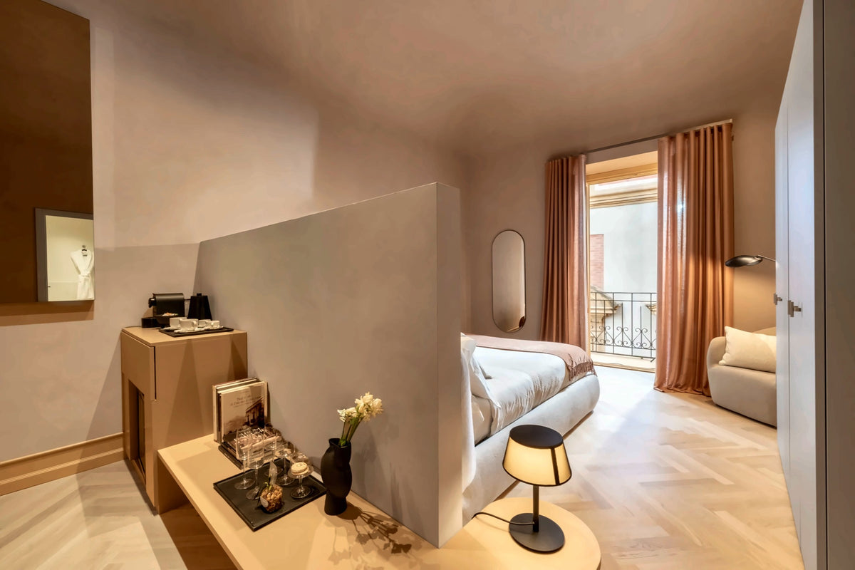 A junior suite at Palazzo Balsamo in soft natural light