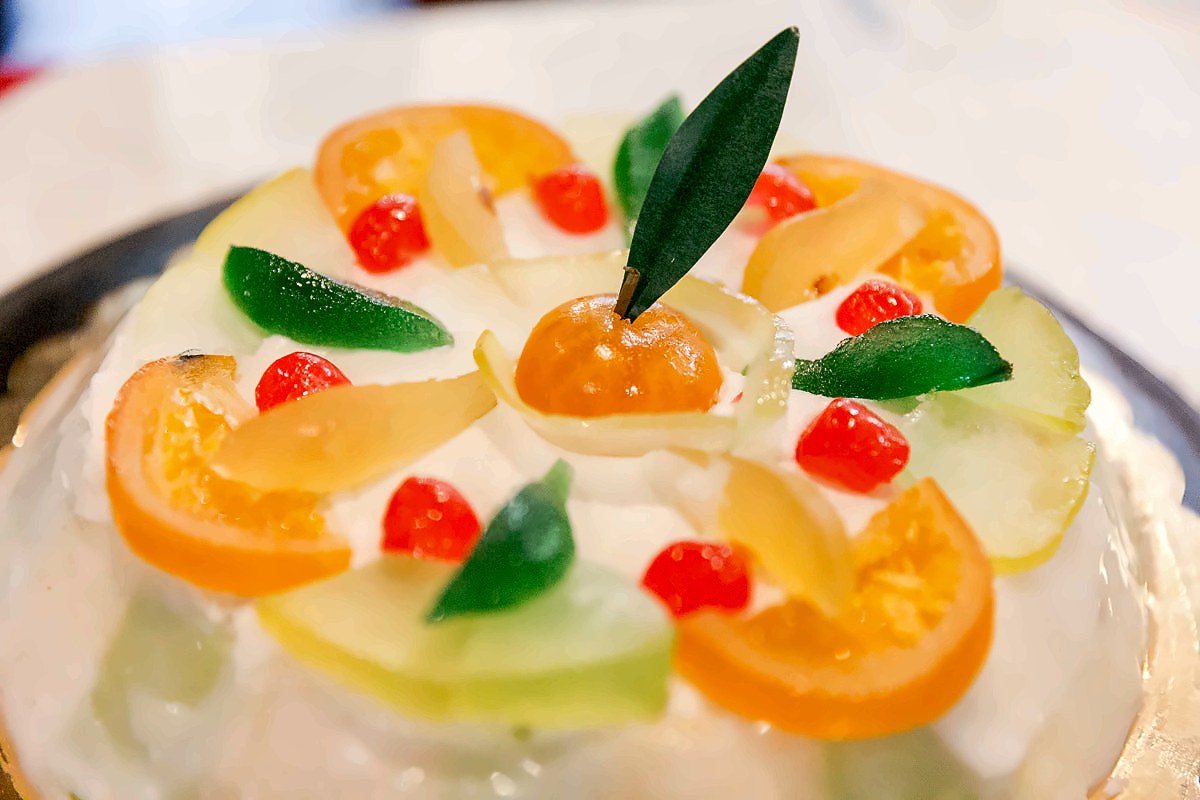 A dessert decorated with candied fruit at Trattoria del Massimo
