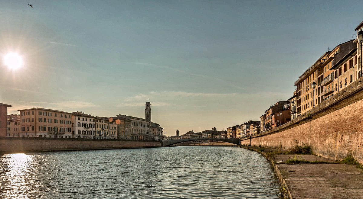 Low sun over the Arno, with the city towers on the skyline