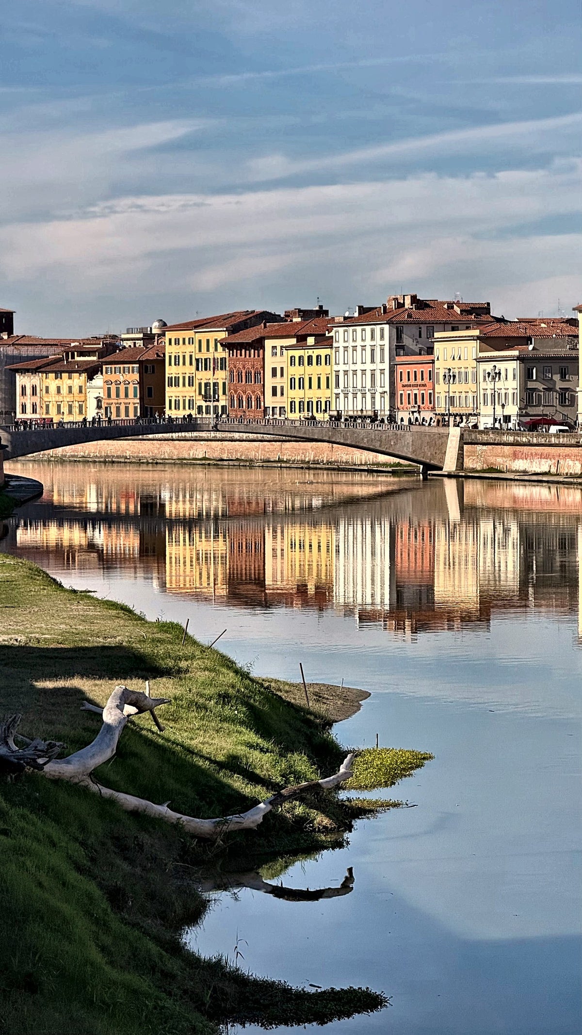 Riverside houses doubled in the Arno on a clear day