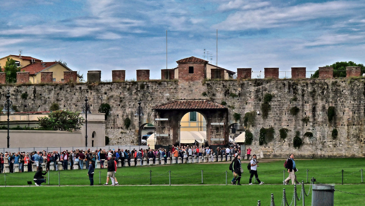 The medieval city walls and Porta Santa Maria beside Piazza dei Miracoli