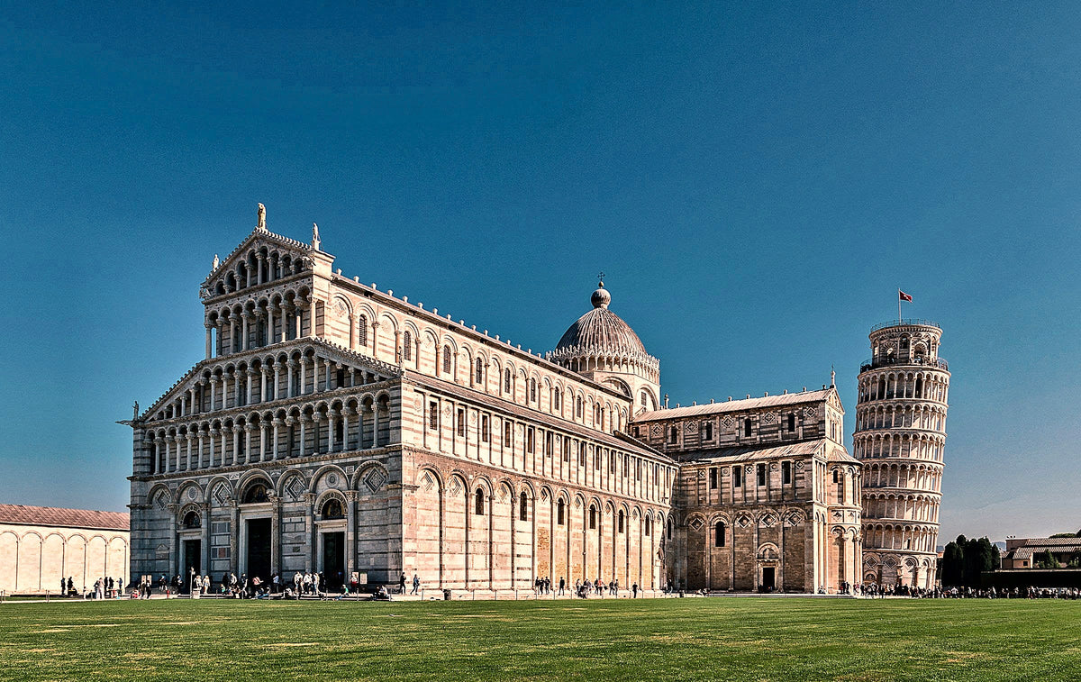 The cathedral and the leaning tower under a deep blue sky